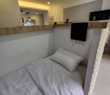 Taman Mount Austin Apartment | Studio with swimming pool access from the patio at Palazio Mount Austin IKEA AEON by GDRAGON HomeStay