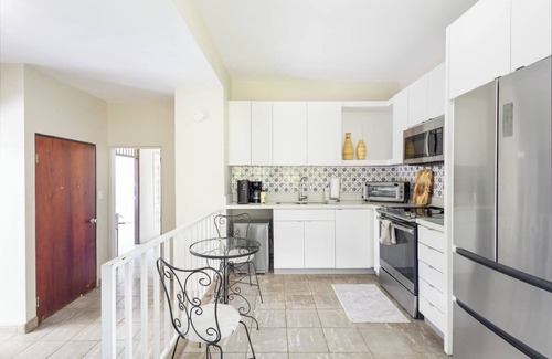 Borinquen Villa | Stunning 1950's grand house nestled in lush greenery overlooking the bay