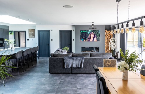 Iron Acton House | Stunning Modern Barn sleep 24 with Hot Tub , Cinema Room and Games Room .