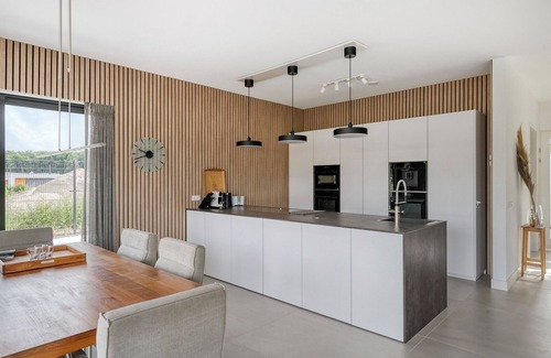 Zeewolde House | Stylish detached 6-person villa with private sauna, three en-suite bathrooms and private dock on the water