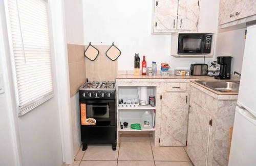 Rock Sound Apartment | Stylish Island Stay| Private Patio + A/C + Wine