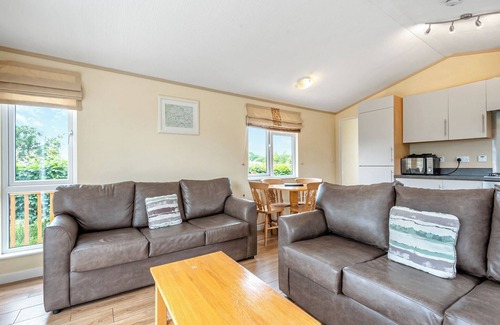 Halfway House Ski Chalet | Stylish luxury lodge with hill view.