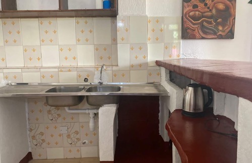 Kampala Apartment | Stylish three bedroom African-themed holiday home! Private baths and kitchen.