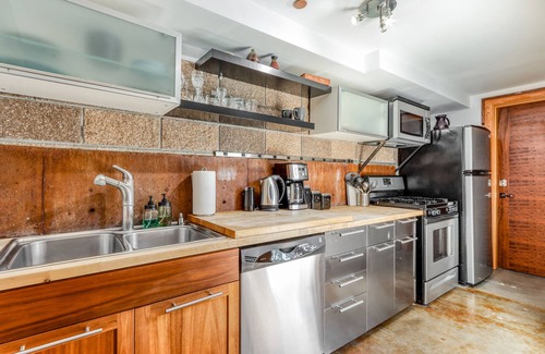 Sisters House | Stylish two-story loft with patio, firepit, W/D & walkable location