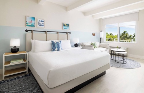 New Town Hotel | Sun, Sip, & Socialize | Island Stay with 2 Pools & Lawn Games