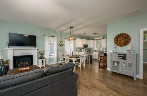 Arundel Cottage | Sunkissed cottage, resort amenities, heated pools, club house, close to beaches
