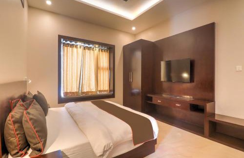 Auli Hotel | Super Townhouse Amaraa Farms Near LuLu Hypermarket