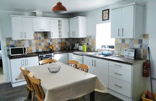 Carrick Cottage | Teach Condy's Cottage nestled at the bottom of Sliabh Liag Cliffs, Co. Donegal