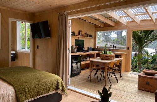 Tryphena House | The Bay Cottage - Located Directly Across the Road from 2 Swimming Beaches