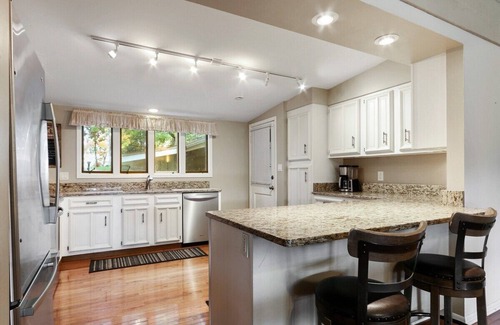 Powers Lake House | The Lake House on Powers |Grassy Frontage |Lakeside Deck |Rec Room w/Pool Table & Bar |Fire Pit