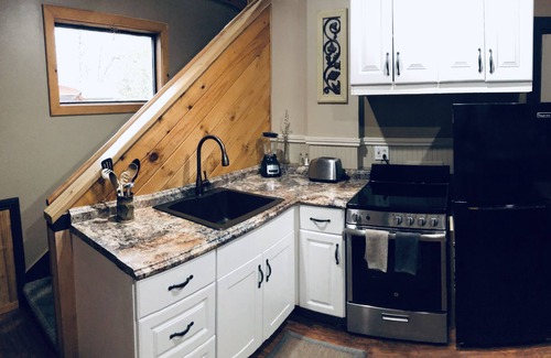 Weaverville House | The Loft King Room w/full kitchen in historic Carriage House building.