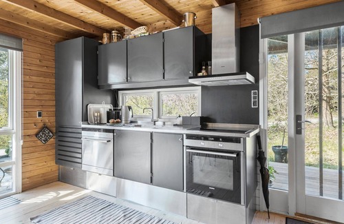 Tisvildeleje House | This attractive wooden house welcomes you in a wooded residential area of Tisvildeleje.