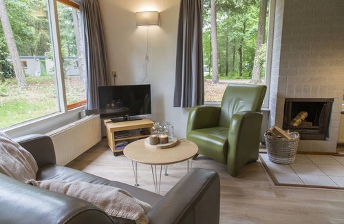 Epe House | Tidy bungalow with fireplace located in the Veluwe