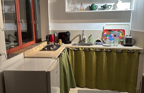 Dun-le-Palestel House | Tiny house-in town-bathroom-garden view