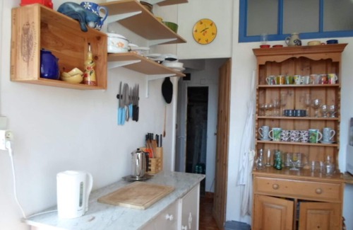Saint-Pierreville House | Traditional blue-shuttered stone house in a stunning Ardeche mountain village.