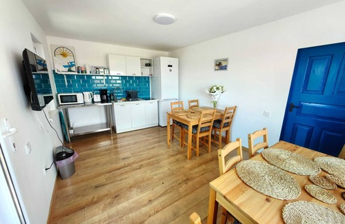 Tulcea County House | Traditional house with one bedroom apartment/fireplace and porch.