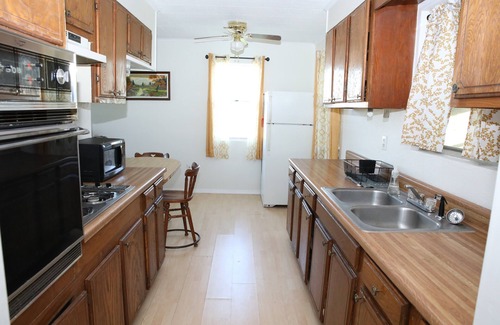 Eastland House | Tranquil Lake House on 2 Acres: Pet-Friendly with Stunning Lake Views.