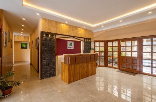 Shoghi Hotel | Treebo Lords Garden Glory - Centralized Heating