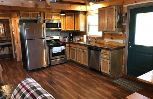 Elmdale Cabin | Unique Paw Print Cabin nestled in the Flint Hills!