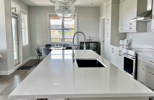 Southwest Calgary Condo | Upscale luxury 2 bed plus office with panoramic views of the rolling foothills!