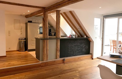 Insel Apartment | Vacation apartment with lake view - maisonette with roof terrace in the old town house on the island