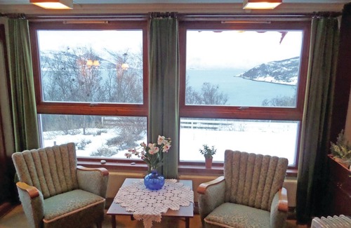Korsfjorden House | Vacation home on a hill with beautiful views of the sea and the mountains.