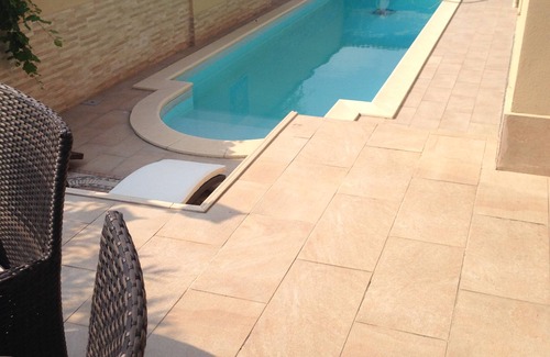 Pogliano Milanese Villa | Villa Le Tre Palme . Suite in relax . immersed in the green garden with swimming pool