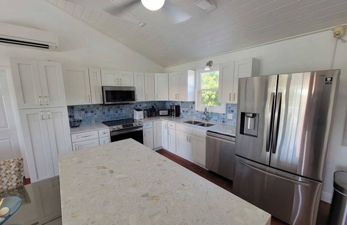 Discovery Bay Villa | Waterfront 5BR Home w/Pool, Gated Parking & Prime Location!