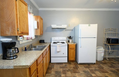 Lake Village House | Watch the sunrise with your family on Lake Chicot!