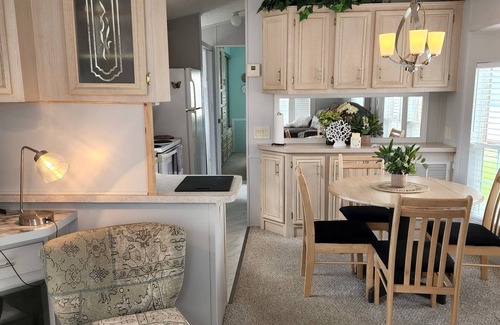 Deltona Lakes Cottage | Waterfront Cottage w/fire pit, grill, community pool, hot tub & more! Dogs ok!