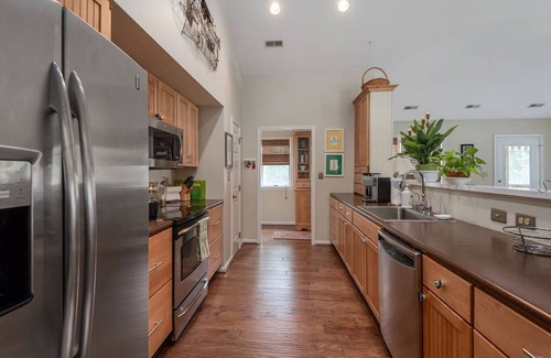 Dogue House | Waterfront home with swimming pool and tennis court.