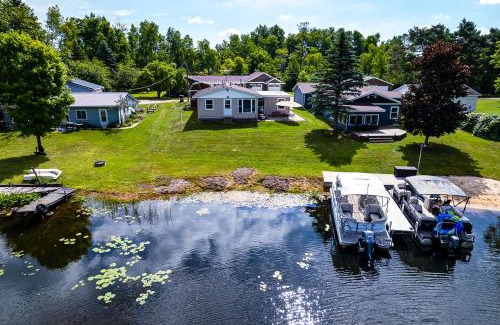 Reed City House | Waterfront Retreat with Dock and Yard in Reed City!