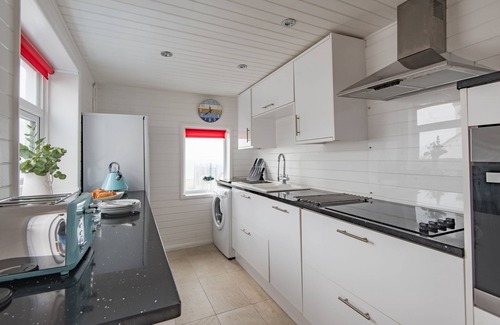 Sandgate Apartment | Wave Cottage - seaside cottage right on the beach by Bloom Stays