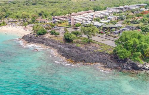 Kahaluu Bay Apartment | White Sands Beach Condo #324. BIG PATIO! Ocean and Mountains across from beach!