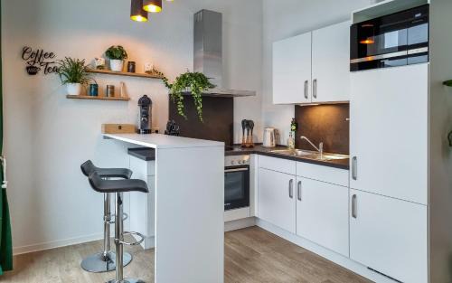 Limburg an der Lahn Apartment | WiLUKA Penthouse mit großer Dachterasse nachhaltig eingerichtet Netflix