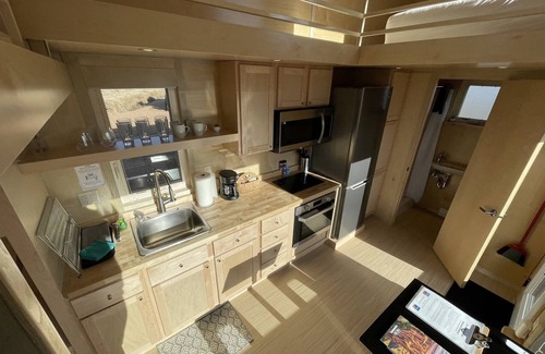 Pear Park House | XL tiny home with two lofted queen beds and full size futon on the main level.