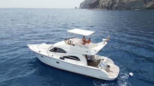 Santa Cruz de Tenerife Boat Rental | Yacht Experience Tenerife 24h plus Tour with private Skipper & private Hostess all inclusive with Cocktails, Sandwiches and free Minibar