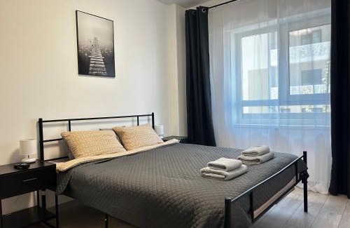 Nord-Est Apartment | Yellow Dawn Modern Flat in Quiet Area with Garage Parking and Self Check-In