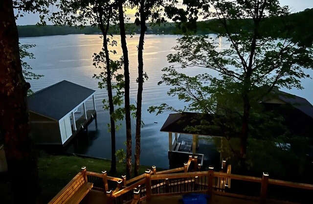 180 degree water views await in this 4 bedroom/3 full bath Hyco Lake Cottage!