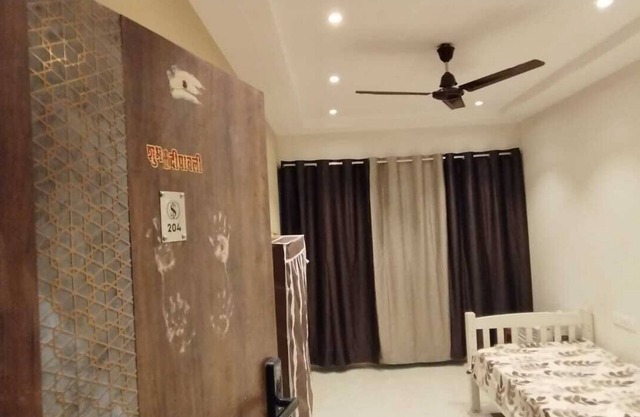 1BHK flat fully furnished bedroom, hallway with single bed balconies.