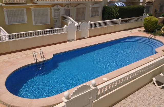 2 bed penthouse, near beach, pool facing balcony, WiFi, air con, roof terrace.