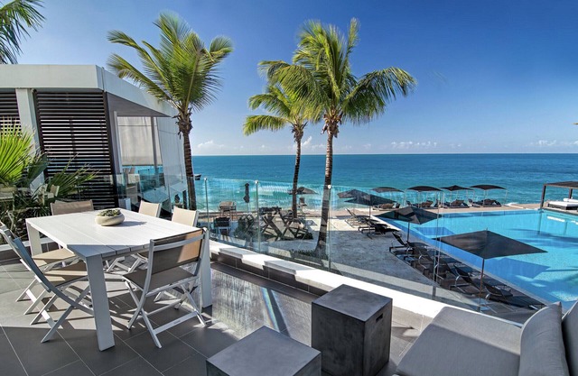 2BD beachfront condo in gated luxury residence, gym/pool, near everything