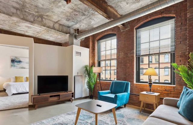 2BR Historic Loft Retreat With Pool & Gym