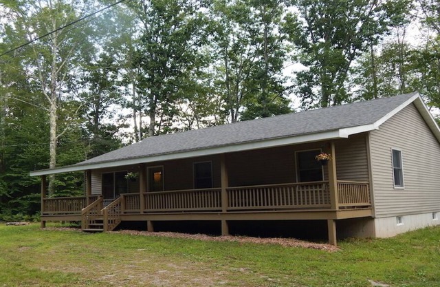 3 Bedroom home with rear deck and covered front porch.