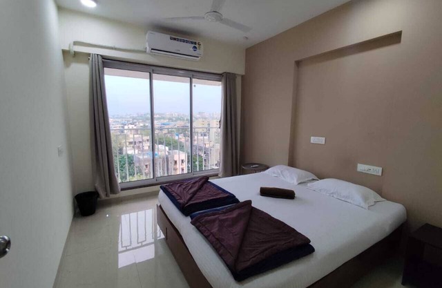 3 BHK Apartment with AC, WiFi, and Rooftop in Santacruz, Mumbai.