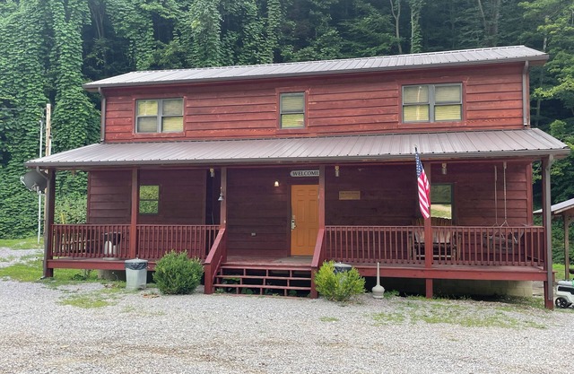 3BR 2 Bath house with full kitchen, living room, and hot tub.