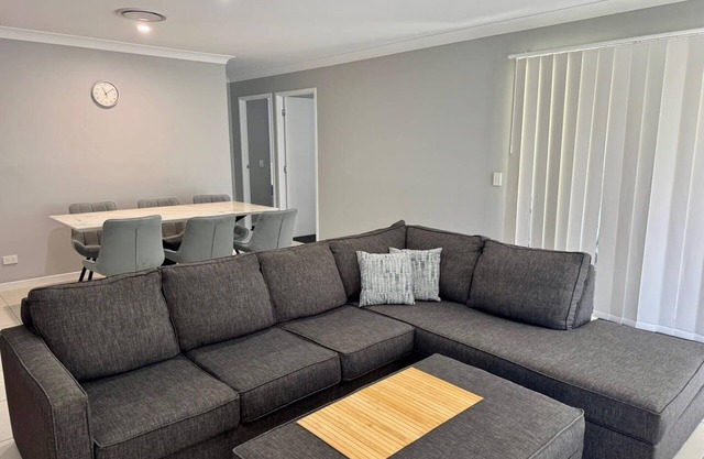 4-BR Home close to beaches and attractions. Includes access to a pool, spa, gym