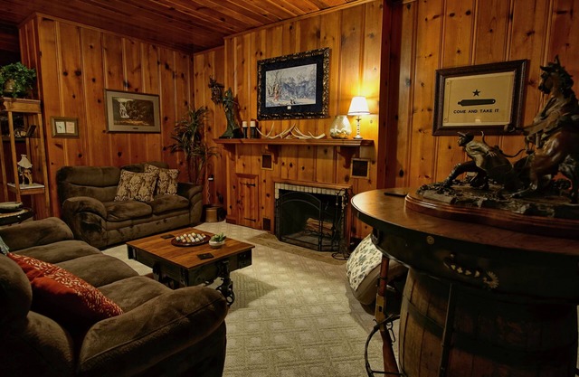 5 Bedrooms, 5.5 Baths, covered porches, hot tub, game room, walk to the square.