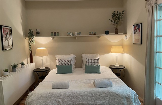 A beautiful romantic bedroom with a mezzanine area, bathroom and private garden