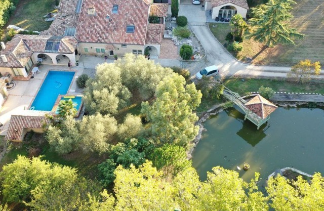 A bucolic stone estate with a cascading pool.